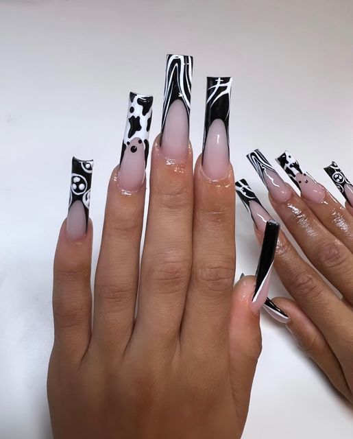 Bold Black and White Long Acrylic Nails with Textured Patterns and Stylish Finishes.