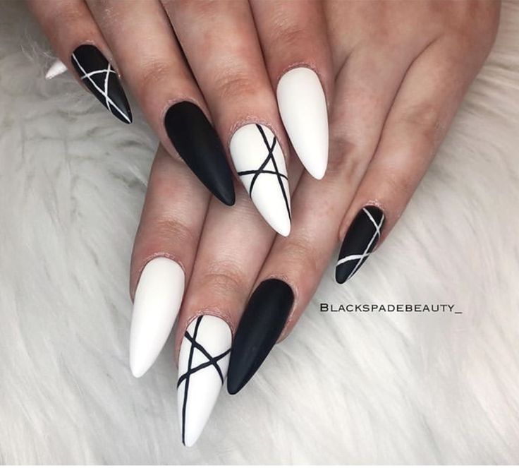 Bold Black and White Angular Nail Design for a Modern, Edgy Look.