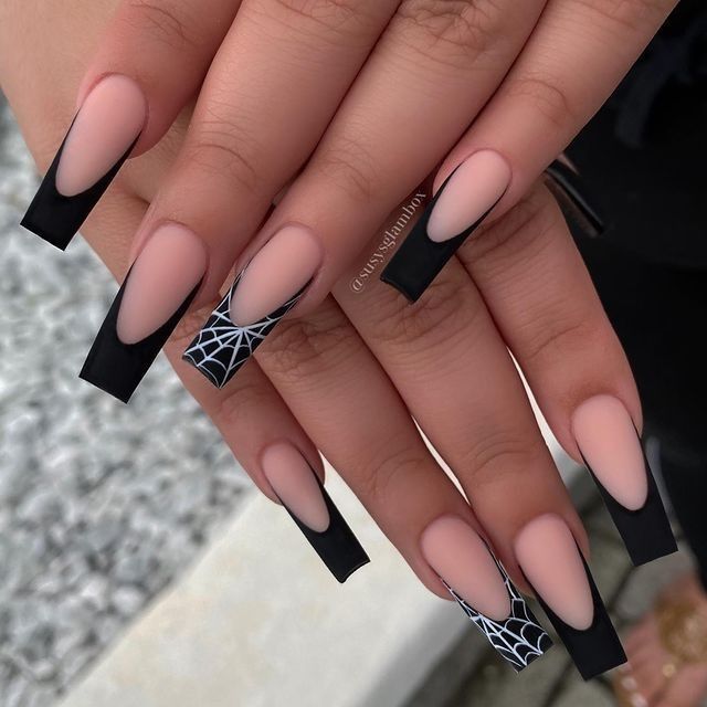 Bold Matte Nude and Black Nail Design with Elegant Spider Web Accent.