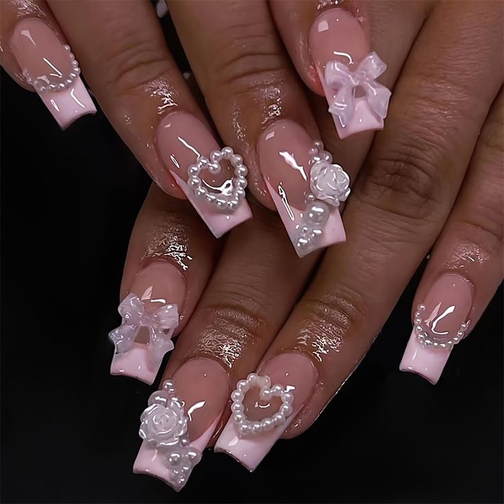 Romantic Soft Pink Nail Design with Elegant Tips and Intricate Embellishments