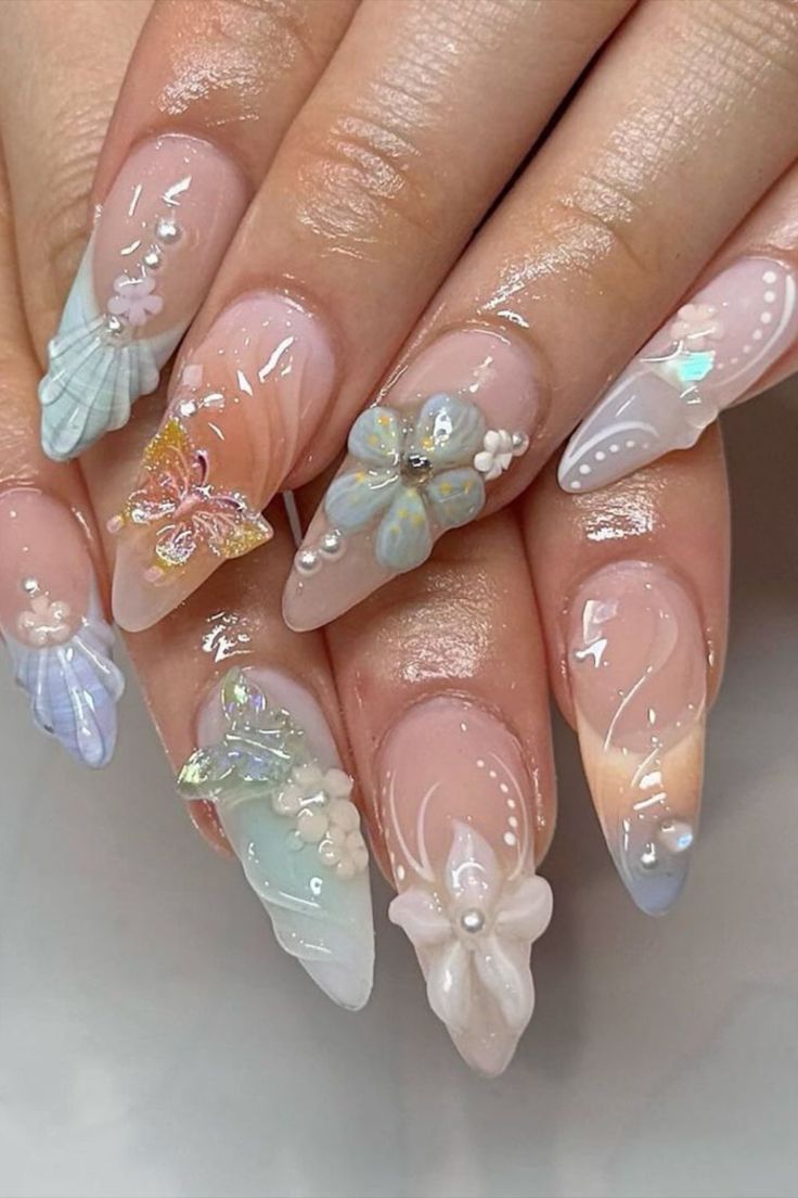 Whimsical Pastel Nail Design with Three-Dimensional Embellishments and Gradient Effects.