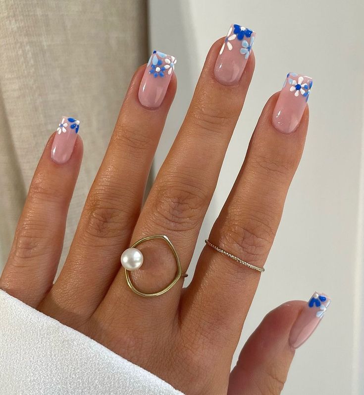 Chic Soft Pink Nail Design with Blue Floral Accents and Elegant Square Tips