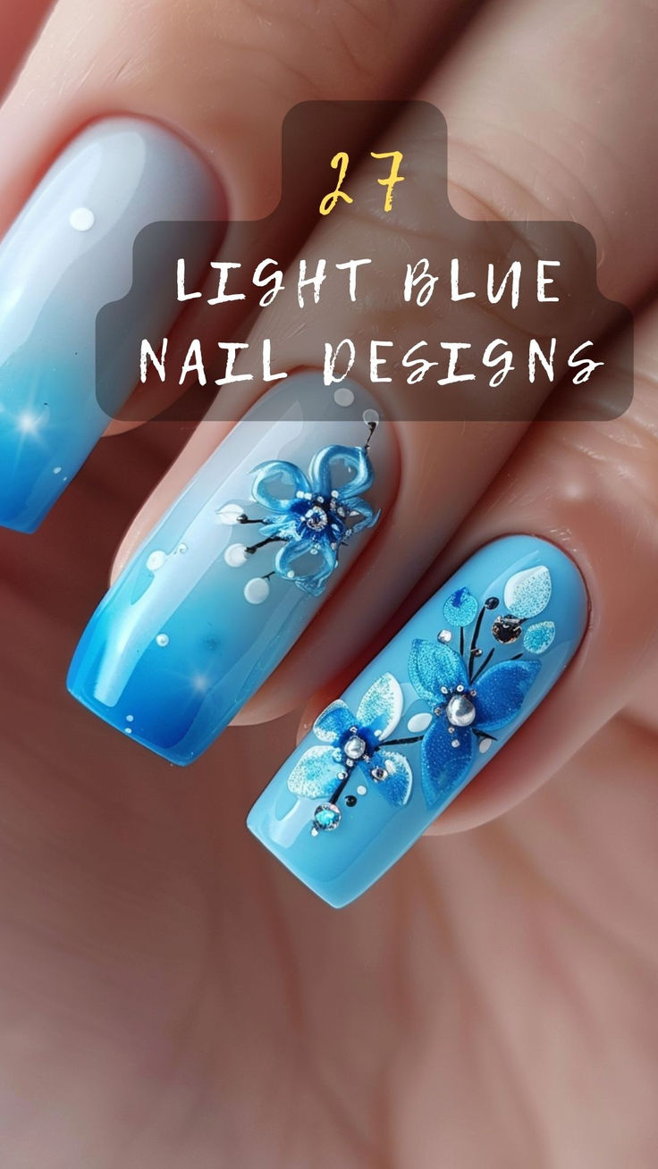 Stunning Gradient Light Blue Nail Design with Elegant Floral Accents and Sparkling Details