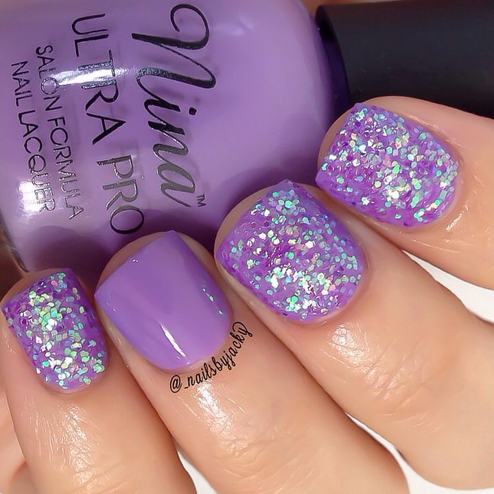 Glamorous Vibrant Purple Nail Design with Glossy Base and Sparkling Glitter Accents