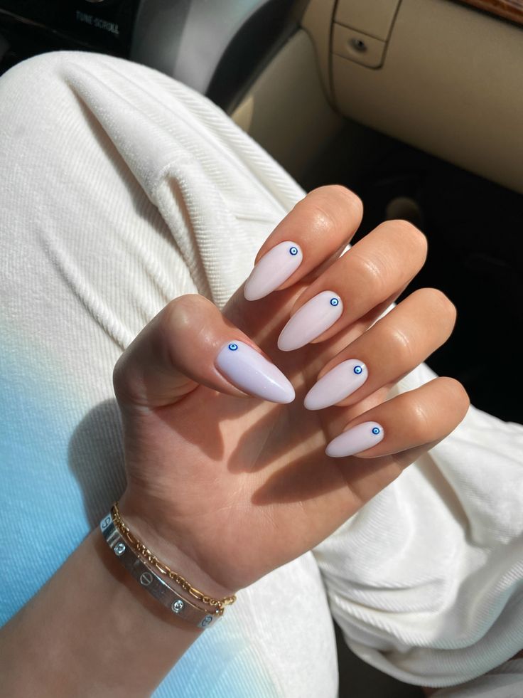 Chic Almond-Shaped Nails with Lavender Base and Playful Blue Dot Accents