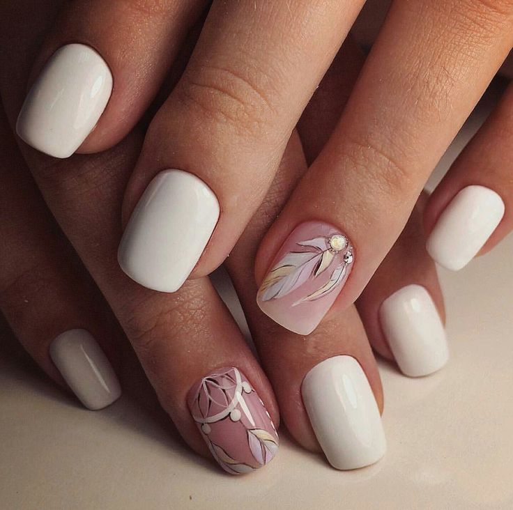 Elegant White and Pink Nail Design with Leaf Patterns and Subtle Embellishments.