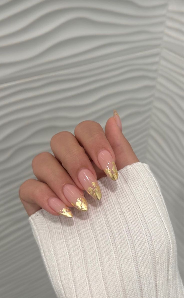 Chic Nude Almond Nails with Luxurious Gold Leaf Tips