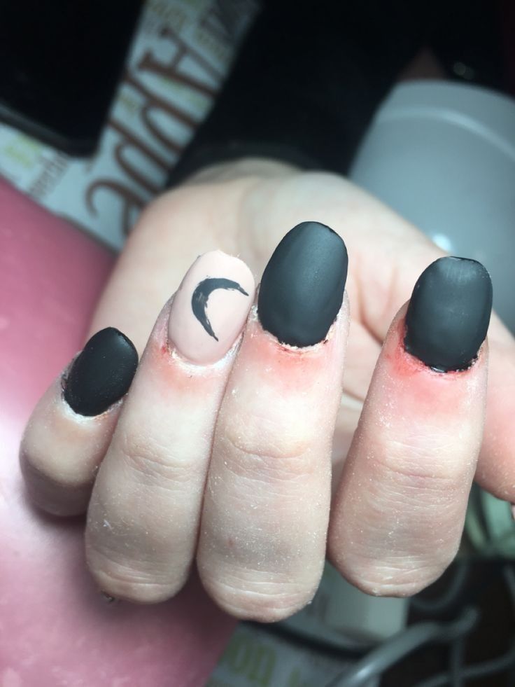 Chic Dark Matte Nails with Nude Crescent Moon Accent for a Bold Yet Understated Look