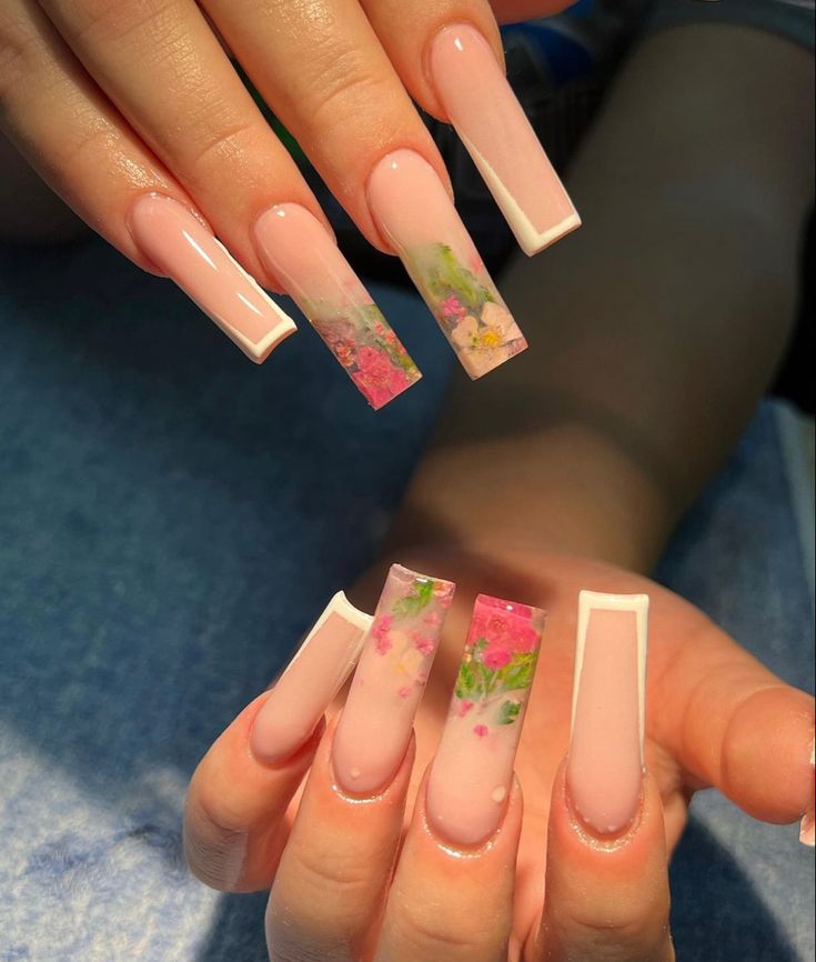 Elegant Floral Nail Design with Soft Nude Base and Crisp White Tips