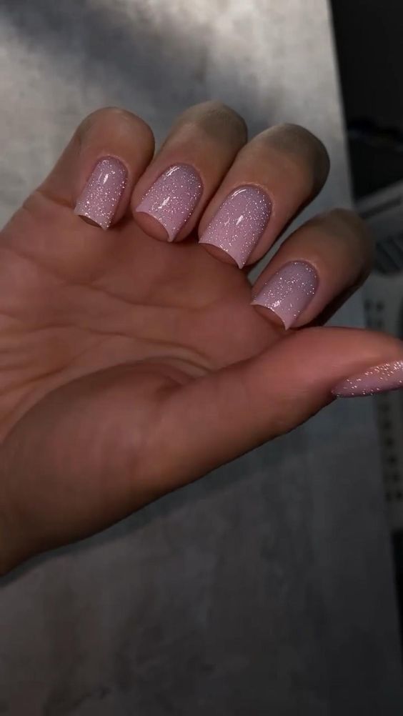 Elegant Glittery Pastel Nails: A Chic Blend of Soft Pink and Sparkle for Any Occasion.