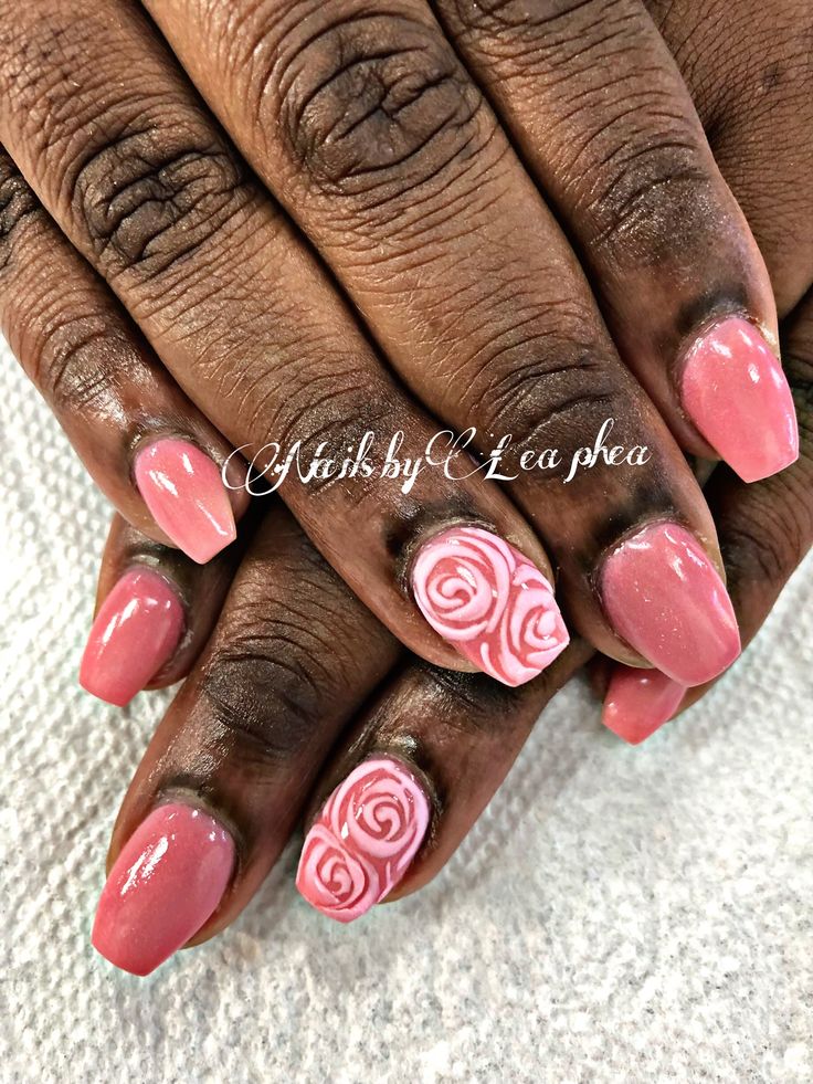 Elegant Chic Nail Design: Soft Pink Base with Glossy Finish and Hand-Painted Rose Accents.