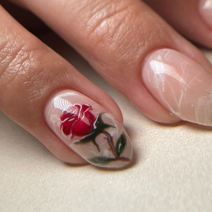 Sophisticated Floral Nail Design with Red Rose on Soft Nude Background.