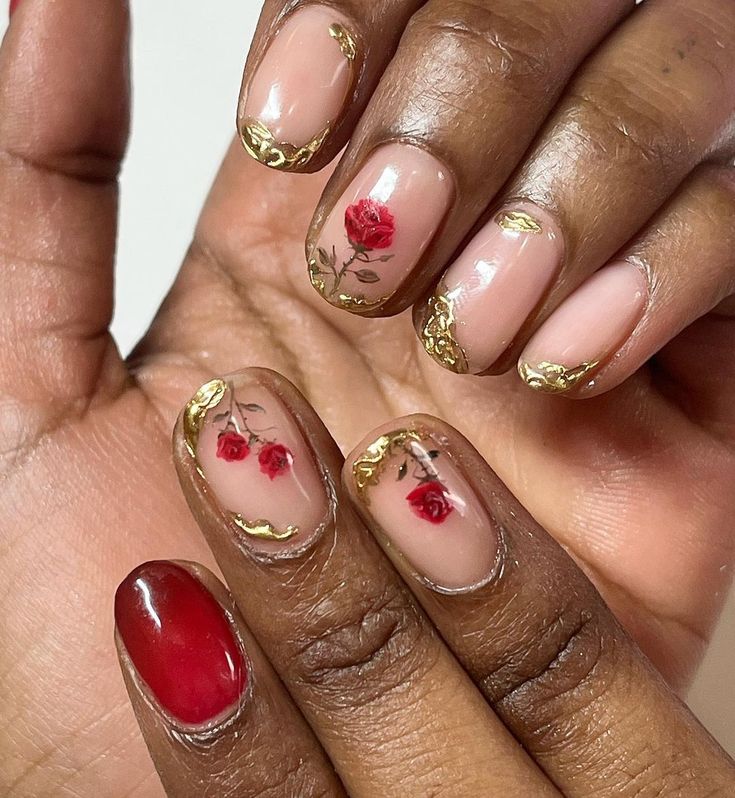 Elegant Floral Nail Design with Red Roses, Gold Accents, and a Nude Base.