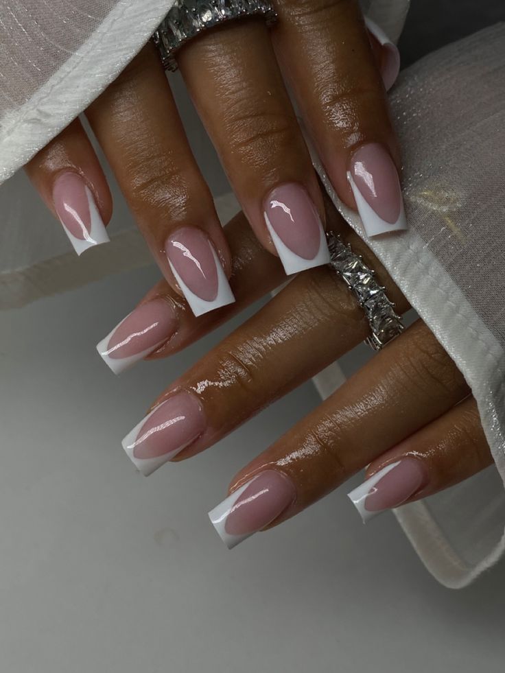 Sophisticated French Manicure: Timeless Elegance with Soft Pink and Crisp White Tips.