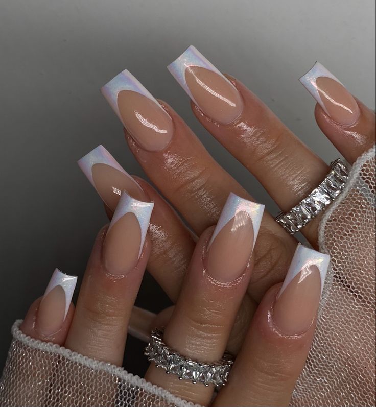 Sophisticated Long Tapered Nails: A Modern Nude and White French Manicure Ensemble.