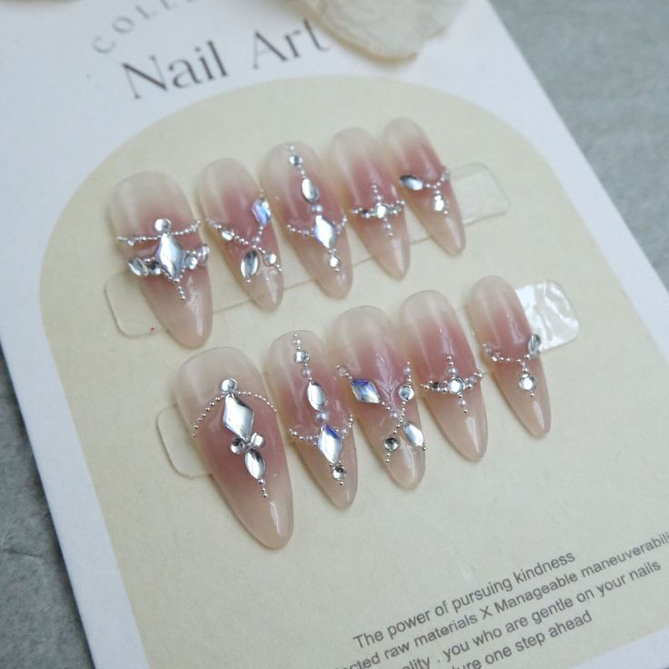 Chic Almond-Shaped Nails with Shimmering Accents and Pink Gradient for a Sophisticated Look.