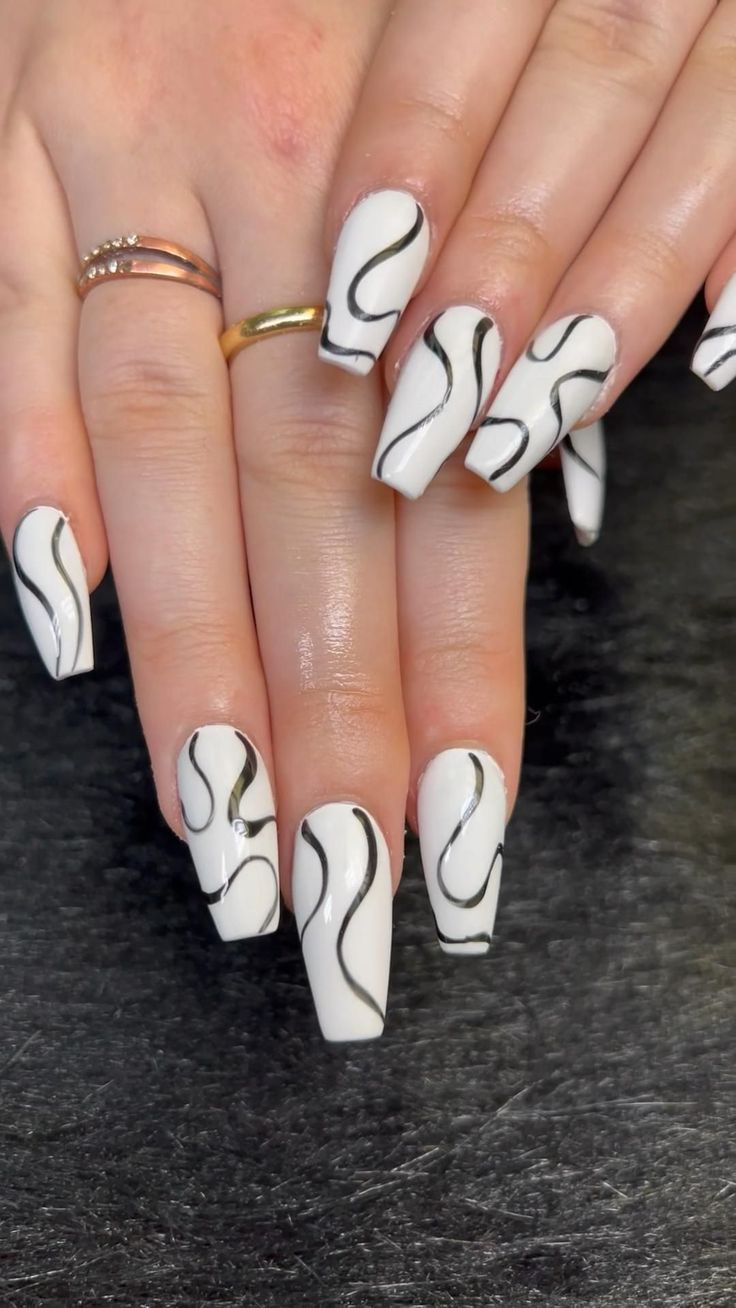 Chic White and Black Wavy Nail Design for Bold Sophistication.