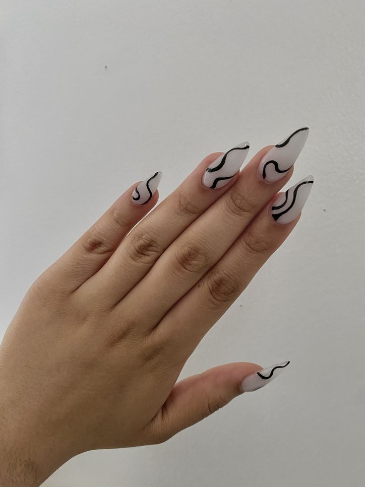 Sophisticated Glossy Nude Nails with Bold Black Wavy Lines.