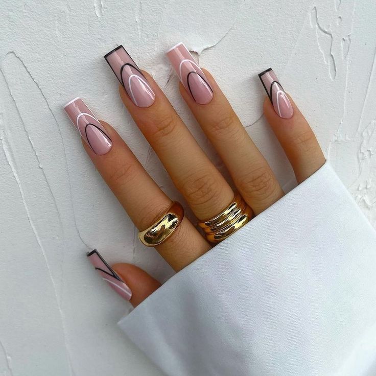 Chic Modern Nail Design: Elegant Long Squared Tips with Soft Pink Base and Artistic Black Accents, Finished with Stylish Rings.