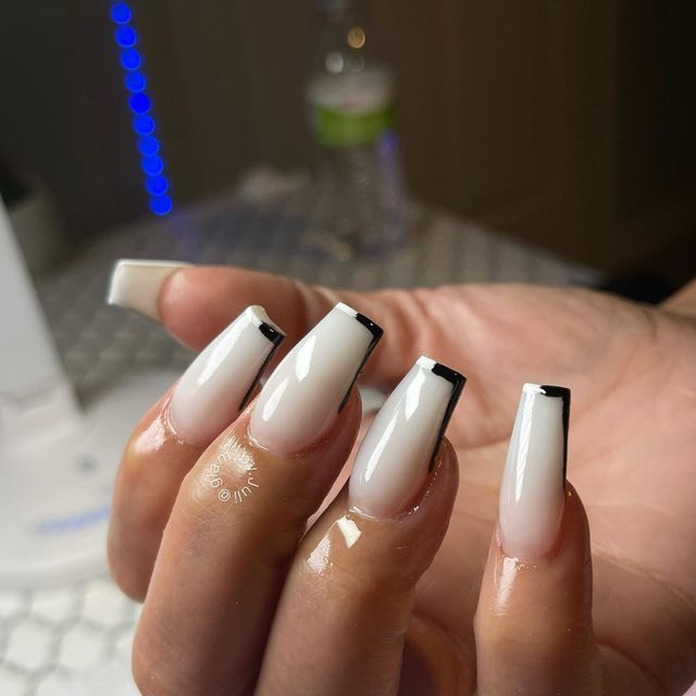 Chic White and Bold Black French Manicure with a Modern Twist