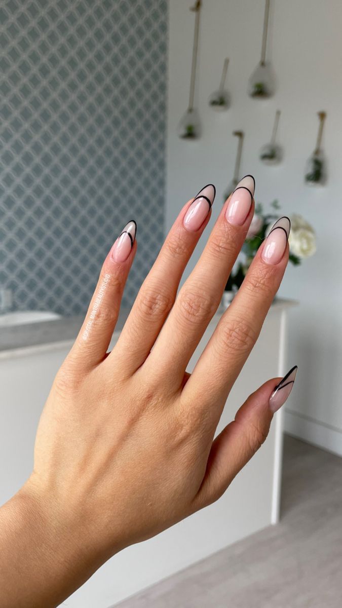 Sophisticated Soft Pink and Black Nail Design: A Modern Twist on Classic French Manicure.