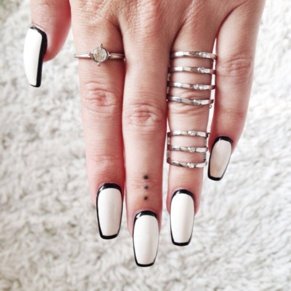 Chic Black and White Nail Design with Sleek Glossy Finish and Silver Accents