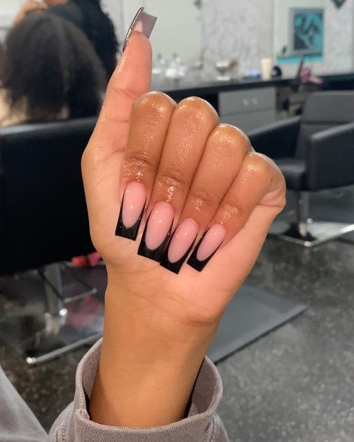 Elegant Nail Design: Striking Soft Pink and Bold Black Contrast