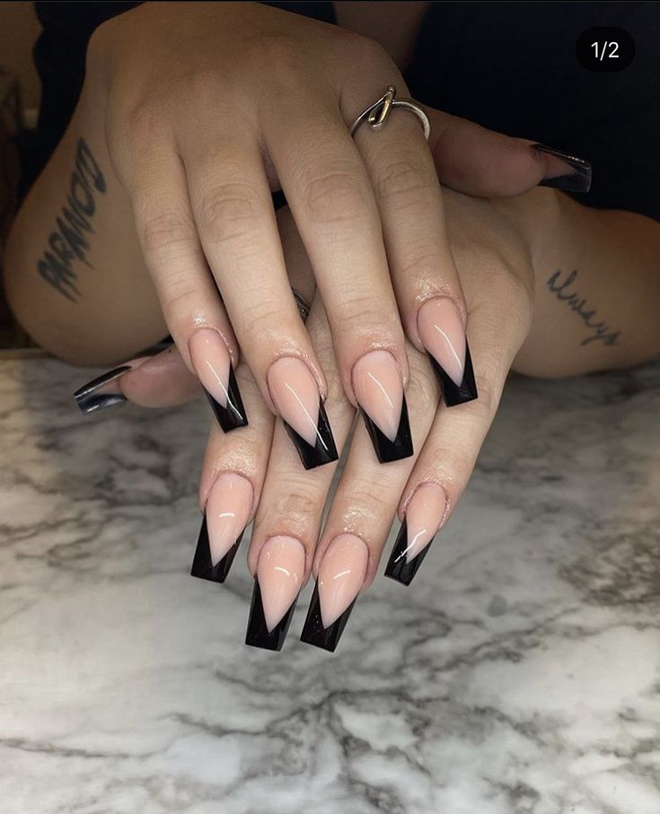 Chic and Edgy: Elegant Acrylic Nails with Bold Black Tips on Soft Nude Base.