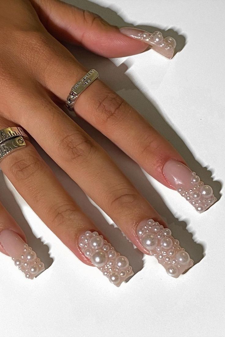 Sophisticated Soft Pink Nail Design with Pearl Embellishments