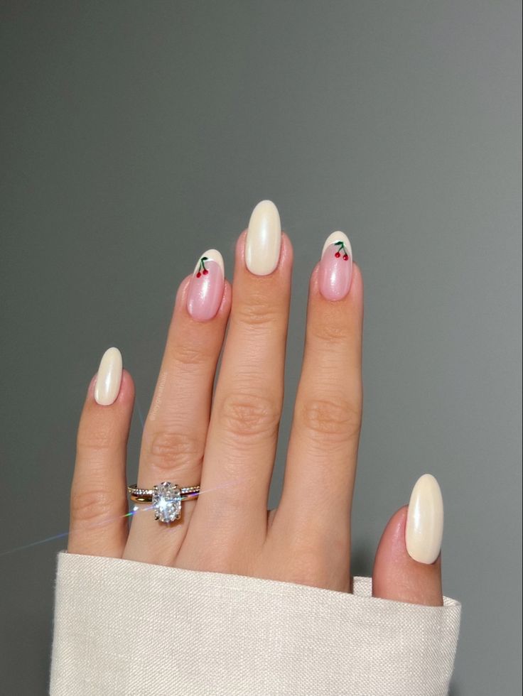 Whimsical Cherry-Accented Almond Nails in Soft Pinks and Creamy Whites for Chic Spring/Summer Elegance