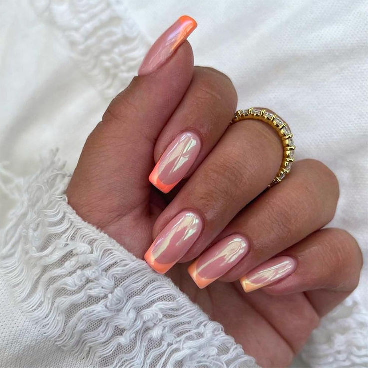 Elegant Soft Peach and Pink Ombre Nail Design for a Trendy Look.