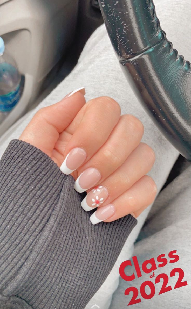 Chic French Manicure with Delicate Floral Accents for Any Occasion