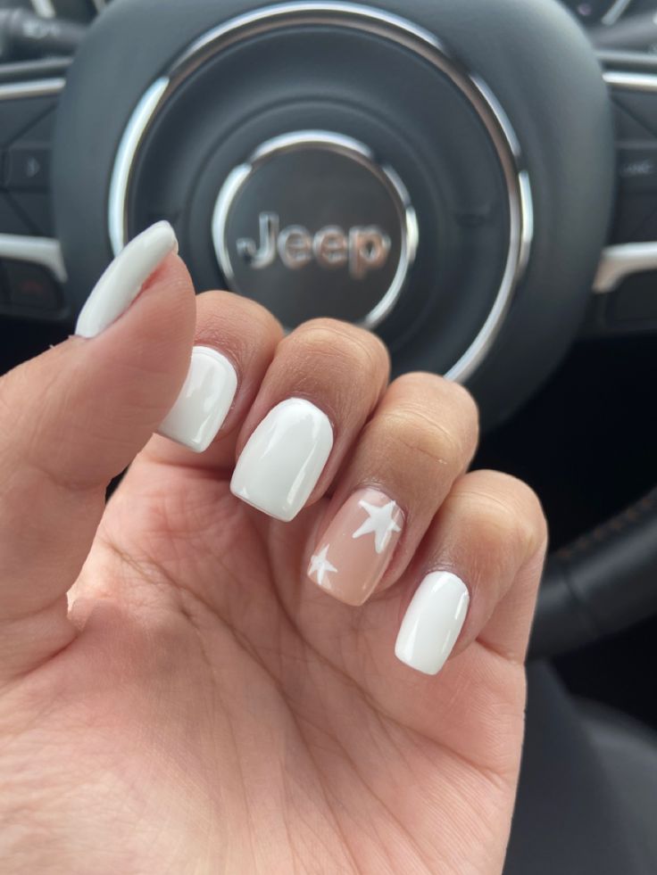 Elegant Classic White Manicure with Playful Star-Accent Nail