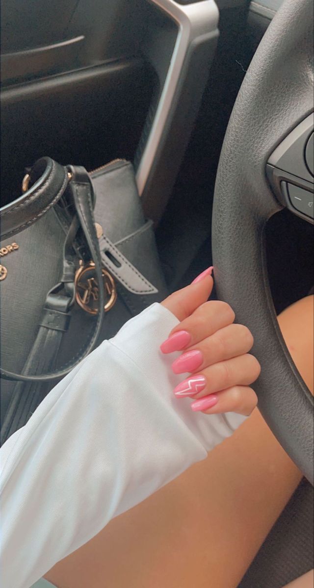 Trendy Pink Nail Design with Glossy Finish and Playful Zigzag Accent.