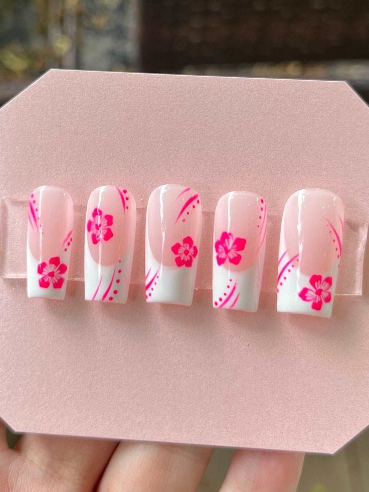 Elegant Spring-Inspired Nail Design: Soft Pink and White with Floral Accents