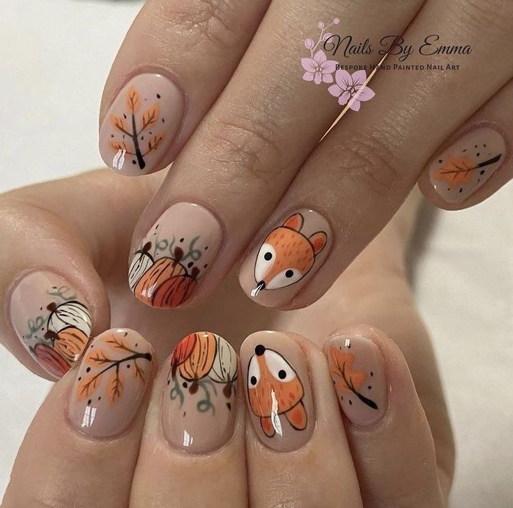 Whimsical Autumn Nail Design Showcasing Warm Colors and Playful Illustrations