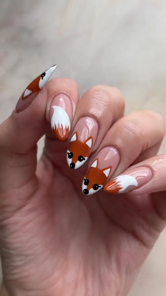 Adorable Fox-Themed Nail Design: Whimsical Manicure with Hand-Painted Faces and Playful Colors.