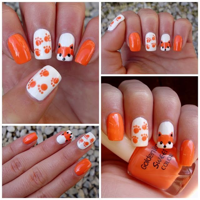 Playful Orange and White Nail Design with Adorable Fox and Paw Print Motifs