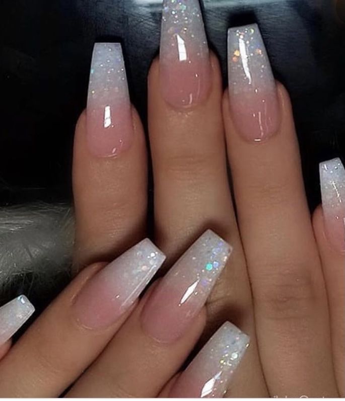 Chic Ombre Nail Design: Smooth Gradient with Glitter Accents on Long Square Nails.