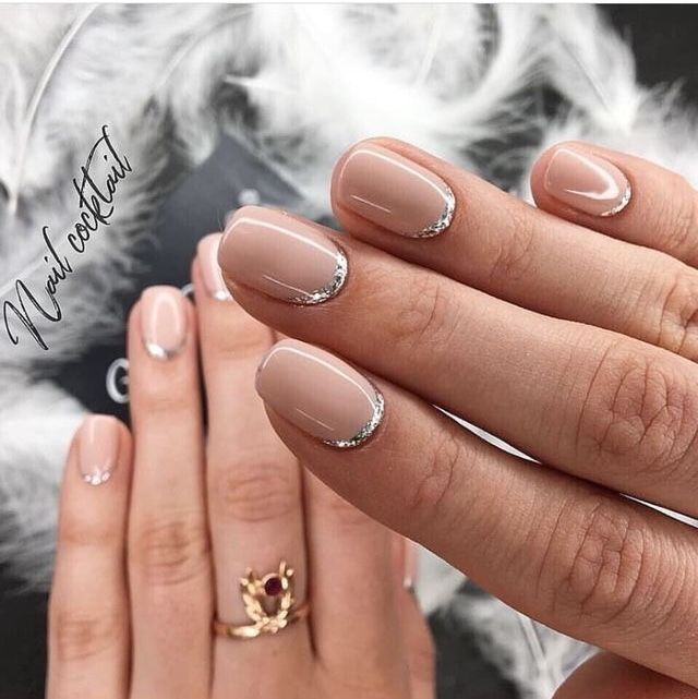 Chic Elegant Nude Nails with Glossy Finish and Silver Tips.