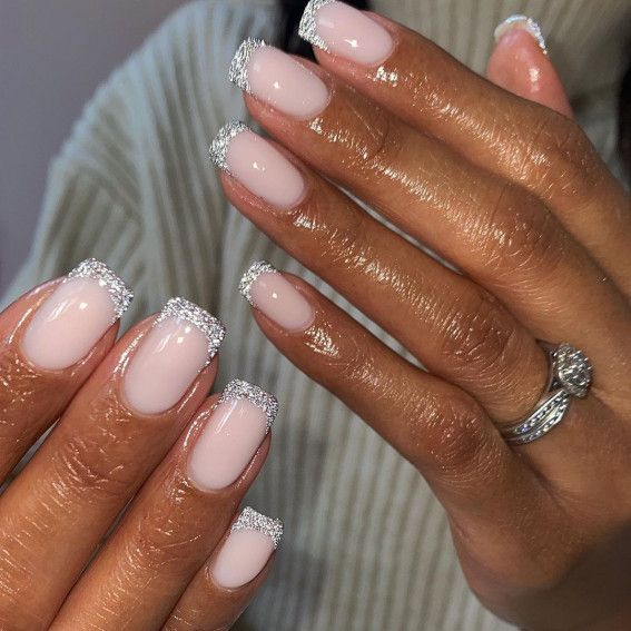 Classy and Sophisticated Elegant Nude Nails with Glittering Silver Tips.