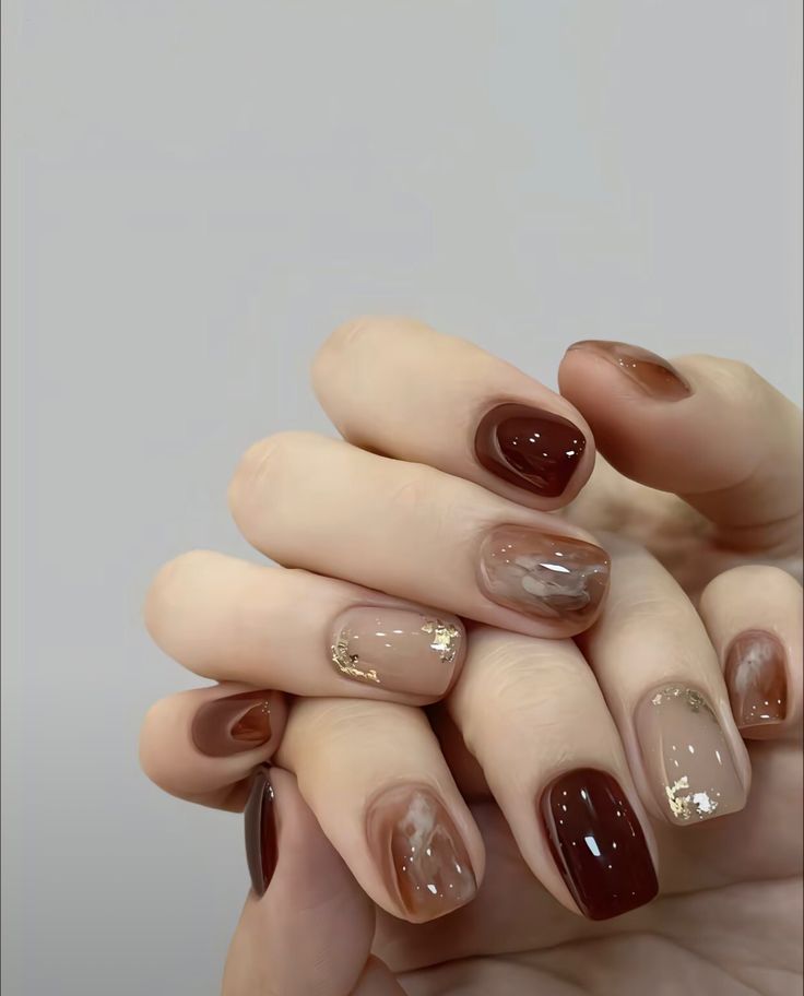 Chic Nail Design: Rich Browns, Soft Nudes, and Glamorous Gold Accents