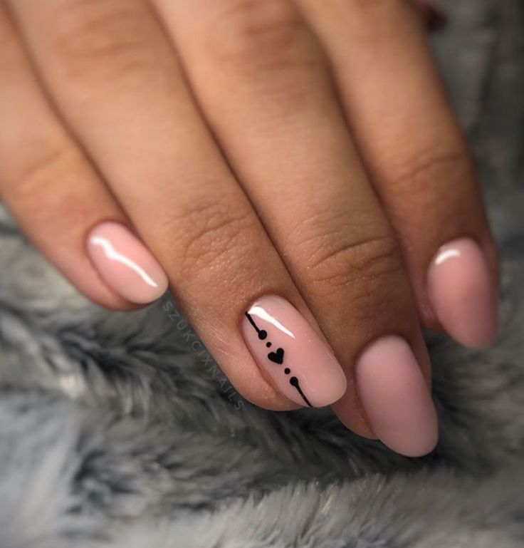 Minimalist Elegant Nude Nails with Subtle Black Lines and Heart Accents.