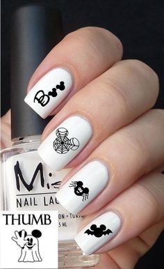 Whimsical Black-and-White Nail Design Featuring Playful Cartoon Characters.