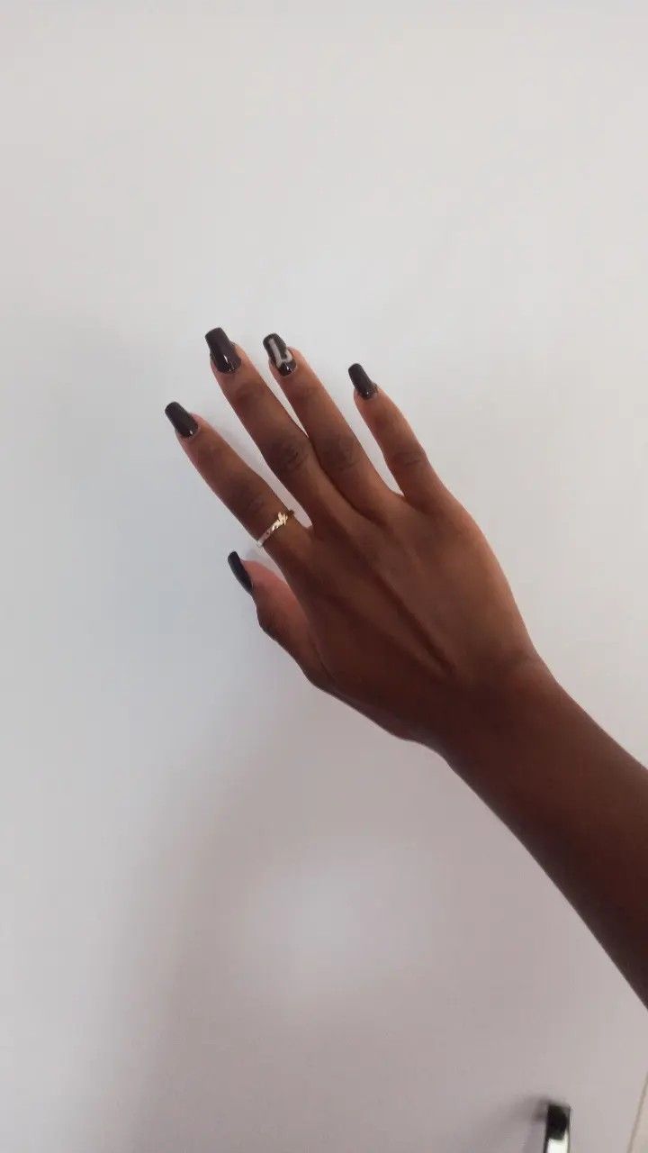 Chic and Sophisticated Nail Design with Dark Glossy Polish and Minimalist Accents.