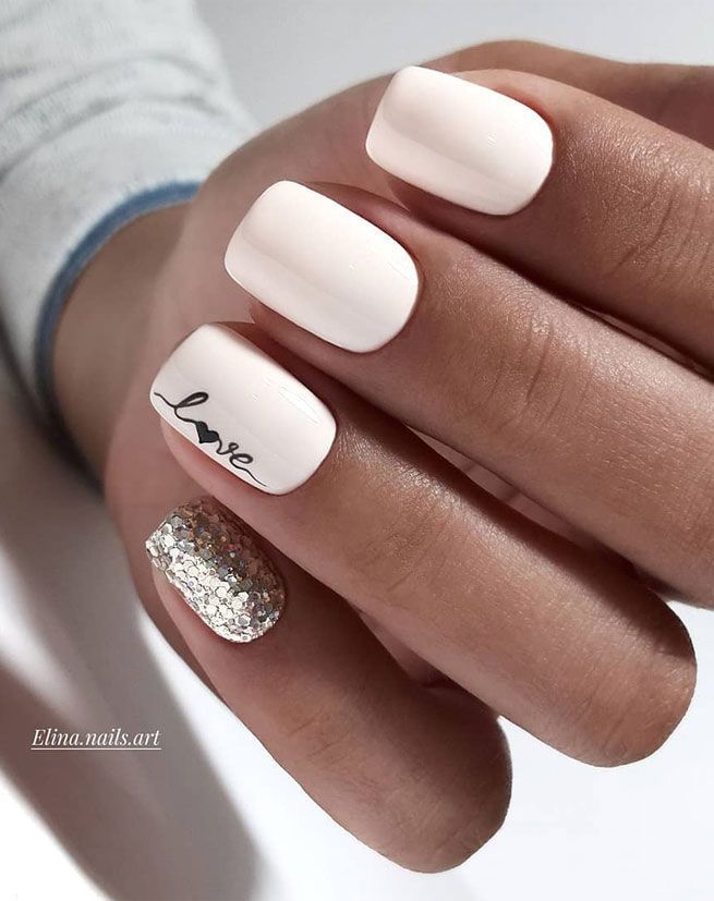 Chic Soft White Nail Design with Glamorous Silver Glitter Accent