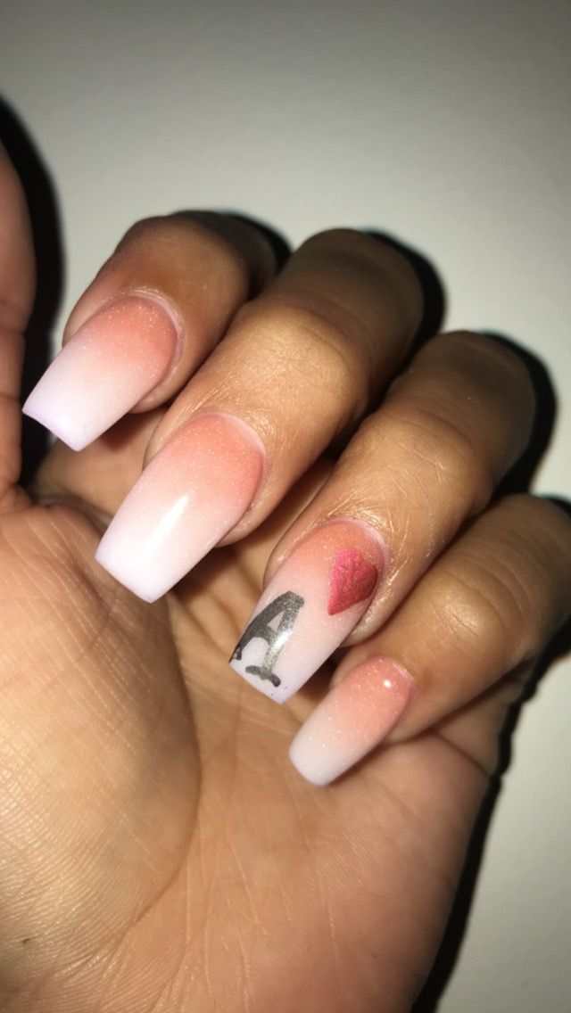 Elegant Ombre Nail Design with Soft Pink, White, and Personal Artistic Touches.