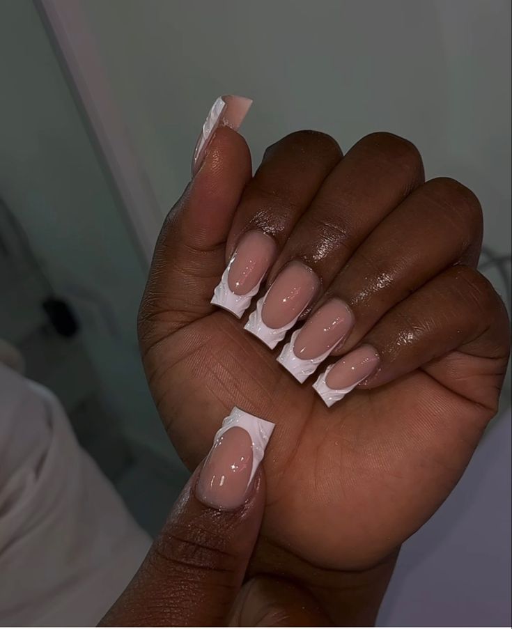 Chic Minimalist Nail Design: Soft Nude Base with Glossy Finish and White Accents