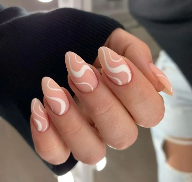 Chic Almond-Shaped Nails: Elegant Nude Base with White Waves and Matte Finish