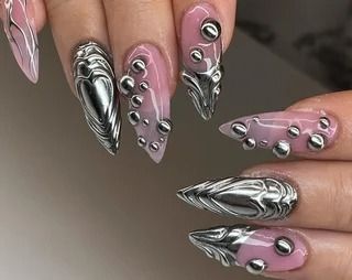 Dramatic Pink and Metallic Silver Nail Design with Textured Liquid Droplet Accents.